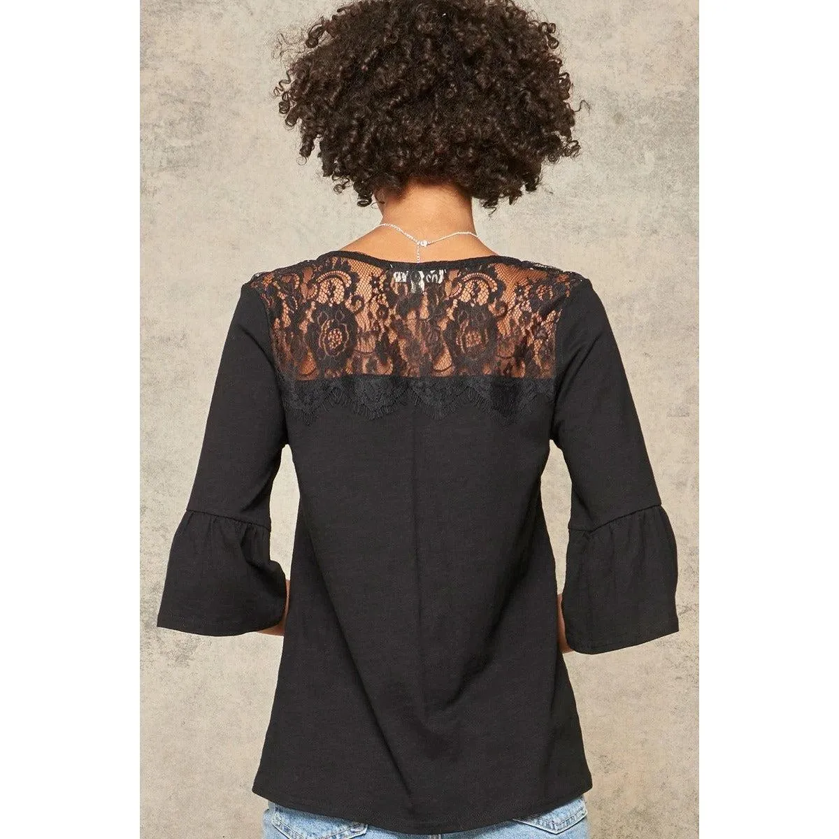 A Knit Top With Deep V Neckline And Yoke Design